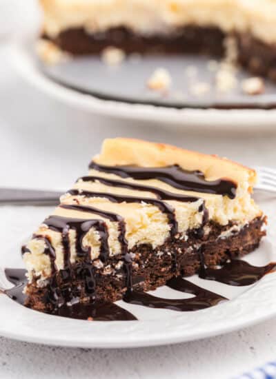 a slice of brownie bottom cheesecake on a plate