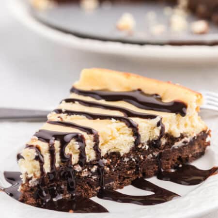 a slice of brownie bottom cheesecake on a plate