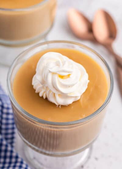 A parfait dish of butterscotch pudding.