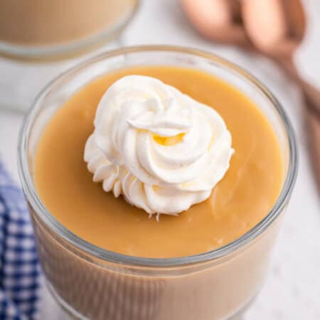 A parfait dish of butterscotch pudding.