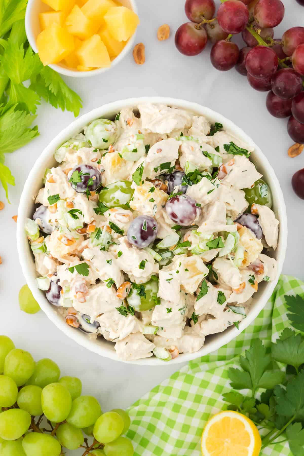 A bowl of chicken salad with grapes.