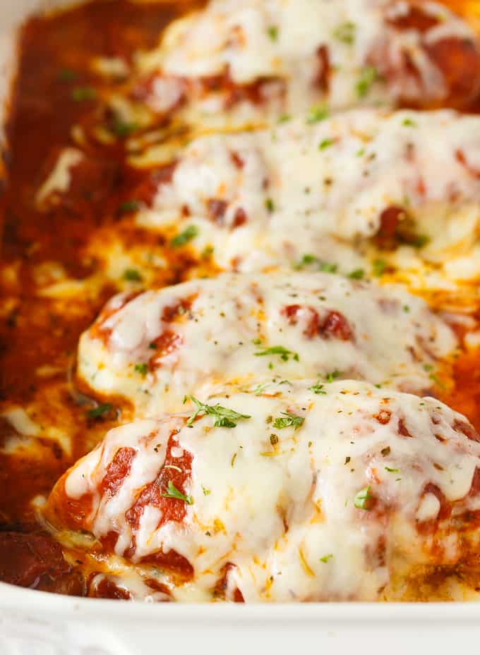 Lasagna Stuffed Chicken - Keto comfort food! Tender chicken breasts are stuffed with a ricotta filling and smothered in marinara sauce and mozzarella cheese.