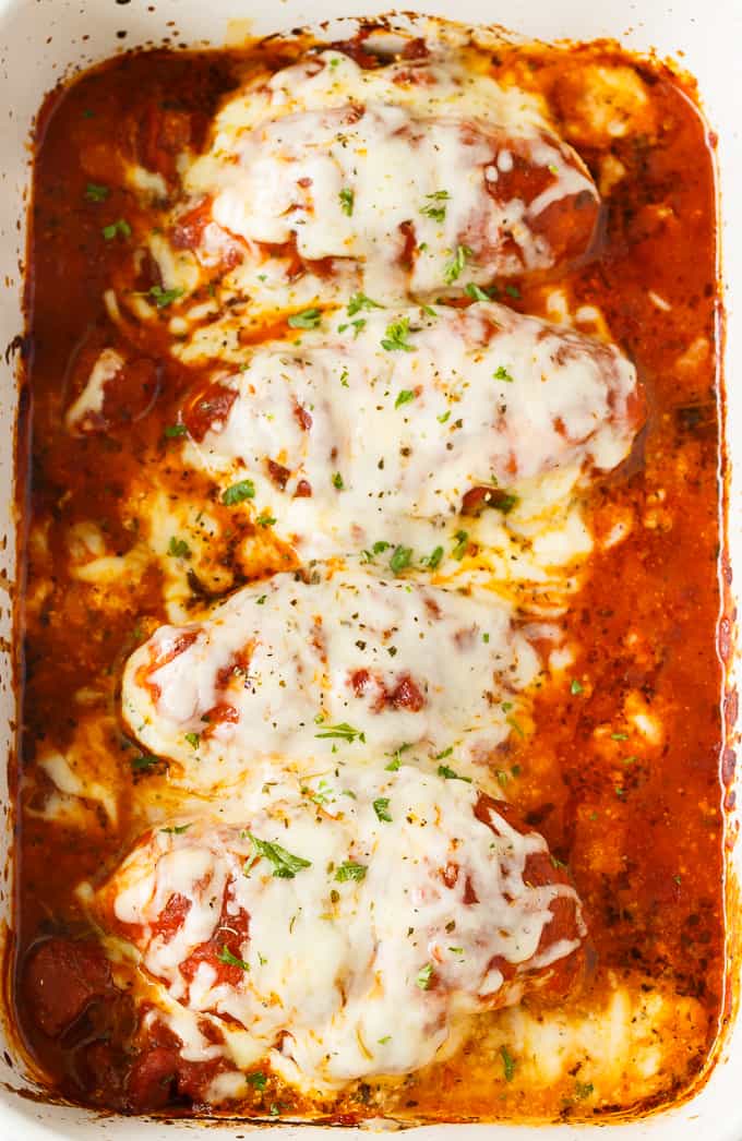 Lasagna Stuffed Chicken - Keto comfort food! Tender chicken breasts are stuffed with a ricotta filling and smothered in marinara sauce and mozzarella cheese.