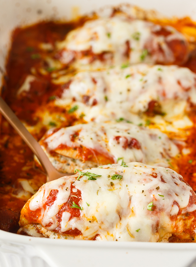 Lasagna Stuffed Chicken - Keto comfort food! Tender chicken breasts are stuffed with a ricotta filling and smothered in marinara sauce and mozzarella cheese.