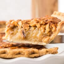 A slice of peanut pie on a spatula.