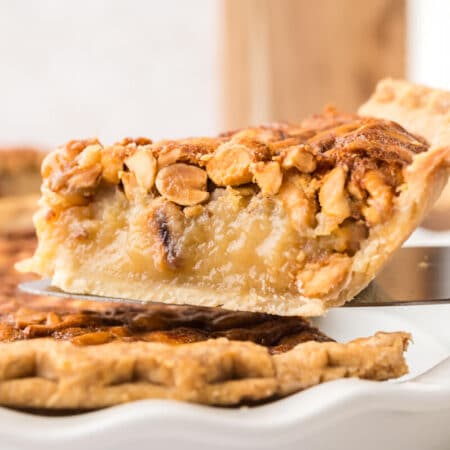 A slice of peanut pie on a spatula.