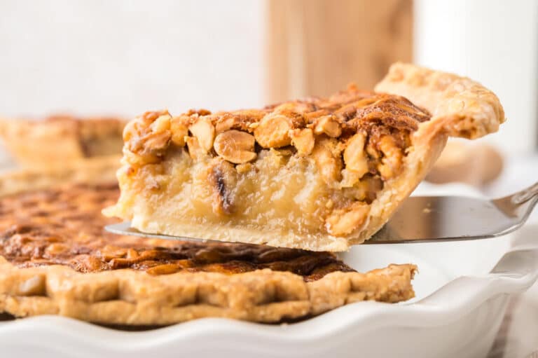 A slice of peanut pie on a spatula.