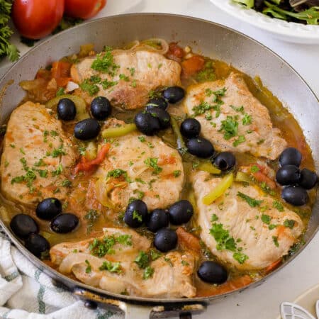 Savory pork chops in a pan.