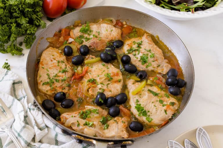 Savory pork chops in a pan.