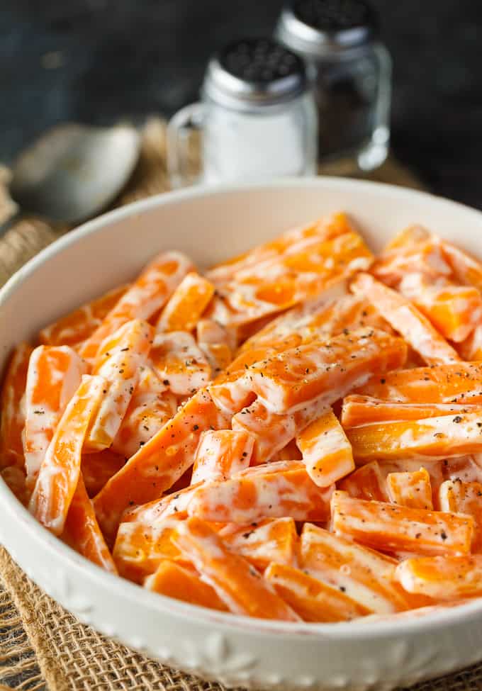 Creamy Carrots - A vibrant and bright holiday side dish recipe! Your kids will love these carrots with just sugar, salt, mayo, and cream.