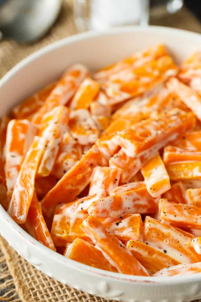 Creamy Carrots - A vibrant and bright holiday side dish recipe! Your kids will love these carrots with just sugar, salt, mayo, and cream.