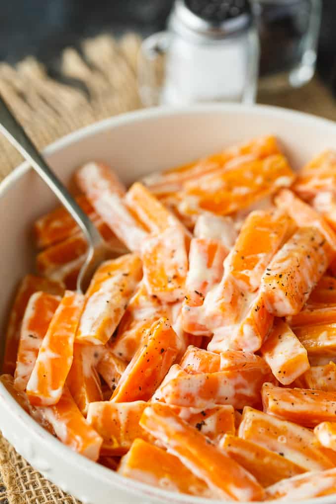 Creamy Carrots - A vibrant and bright holiday side dish recipe! Your kids will love these carrots with just sugar, salt, mayo, and cream.