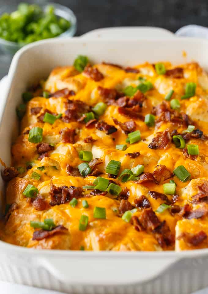 Bacon and Egg Biscuit Casserole - An easy breakfast casserole recipe made with eggs, bacon and biscuits. It's super easy to whip up and can be made the night before and kept in the fridge.