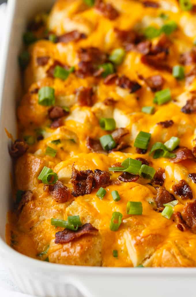 Bacon and Egg Biscuit Casserole - An easy breakfast casserole recipe made with eggs, bacon and biscuits. It's super easy to whip up and can be made the night before and kept in the fridge.