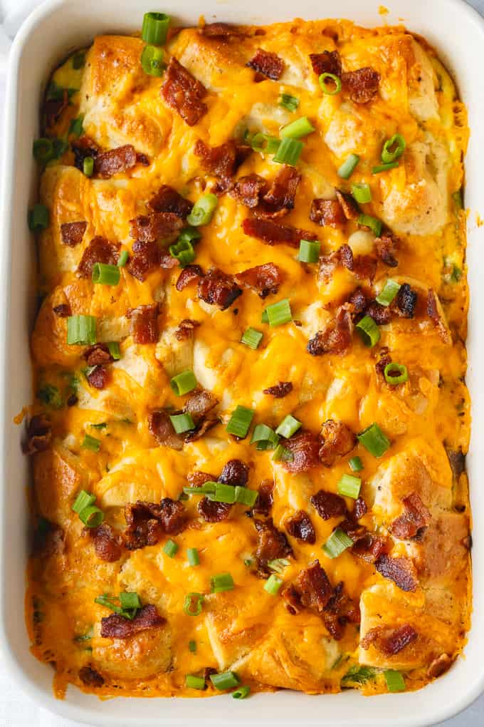 Bacon and Egg Biscuit Casserole - An easy breakfast casserole recipe made with eggs, bacon and biscuits. It's super easy to whip up and can be made the night before and kept in the fridge.