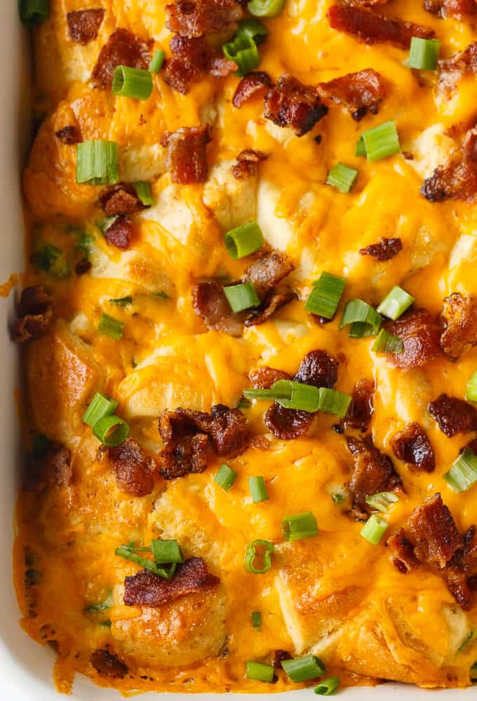 Bacon and Egg Biscuit Casserole - An easy breakfast casserole recipe made with eggs, bacon and biscuits. It's super easy to whip up and can be made the night before and kept in the fridge.