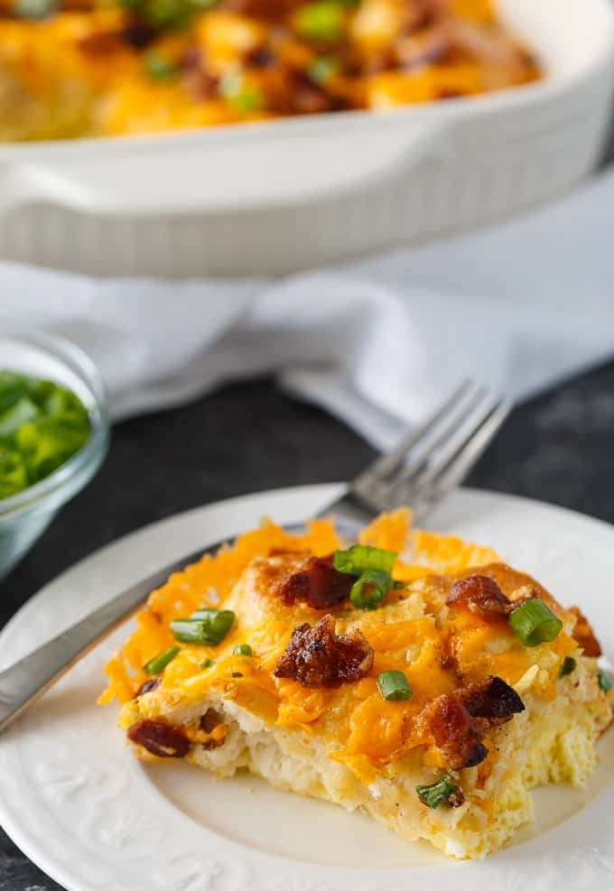 Bacon and Egg Biscuit Casserole - An easy breakfast casserole recipe made with eggs, bacon and biscuits. It's super easy to whip up and can be made the night before and kept in the fridge.