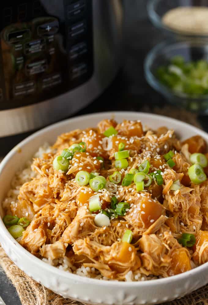 Pineapple Teriyaki Chicken - The easiest Asian-inspired pressure cooker recipe! Tender, juicy shredded chicken cooks to perfection in a sweet and savory homemade teriyaki sauce.