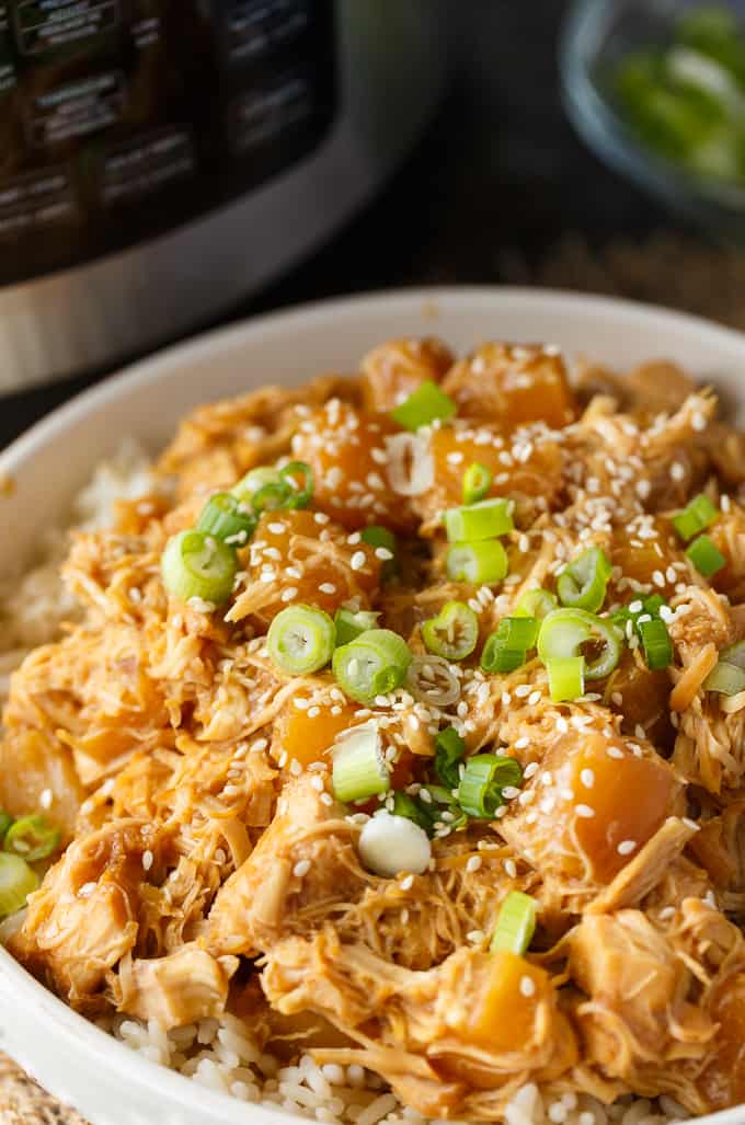 Pineapple Teriyaki Chicken - The easiest Asian-inspired pressure cooker recipe! Tender, juicy shredded chicken cooks to perfection in a sweet and savory homemade teriyaki sauce.
