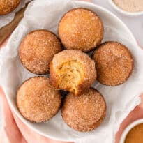 Sugar and spice muffins on a plate.