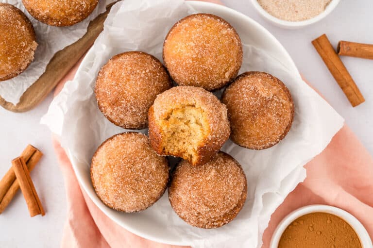 Sugar and spice muffins on a plate.