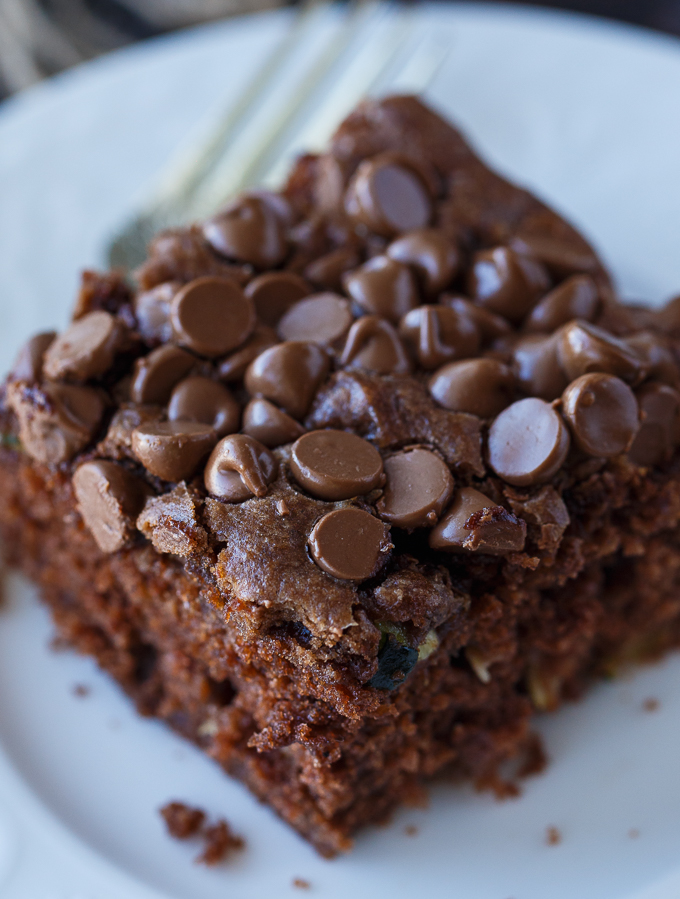 Chocolate Zucchini Cake - Rich, moist and fudgy! This easy cake recipe is the perfect dessert for any chocoholic. The perfect way to use up your garden zucchini.