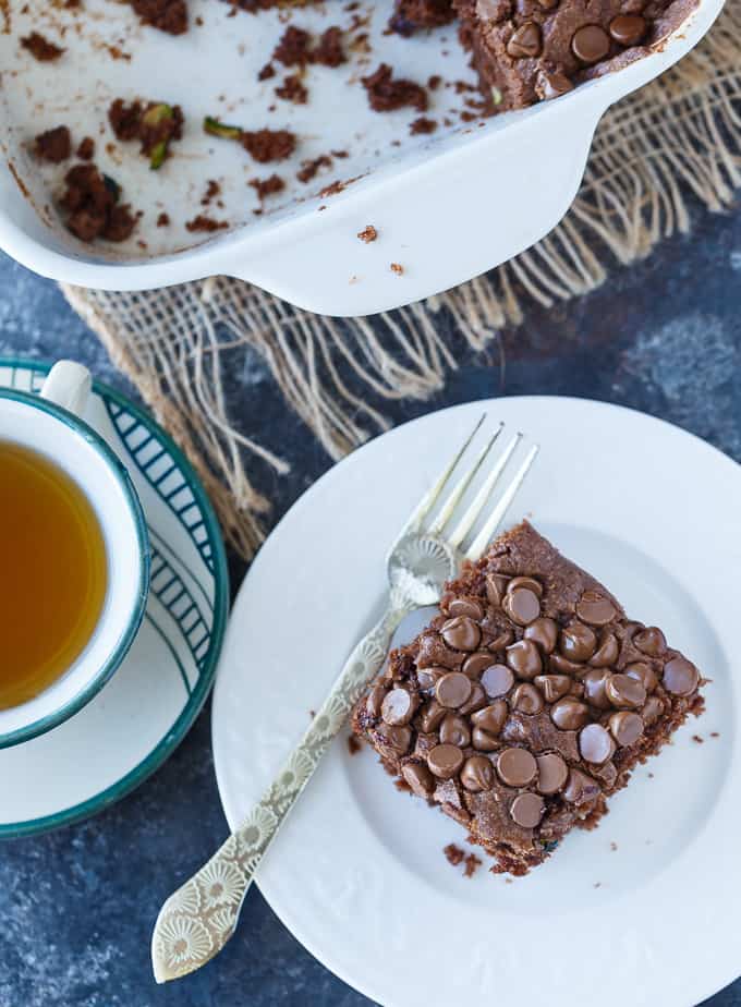 Chocolate Zucchini Cake - Rich, moist and fudgy! This easy cake recipe is the perfect dessert for any chocoholic. The perfect way to use up your garden zucchini.