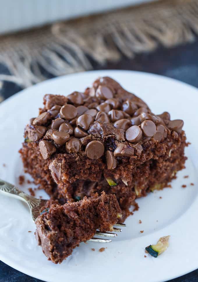Chocolate Zucchini Cake - Rich, moist and fudgy! This easy cake recipe is the perfect dessert for any chocoholic. The perfect way to use up your garden zucchini.