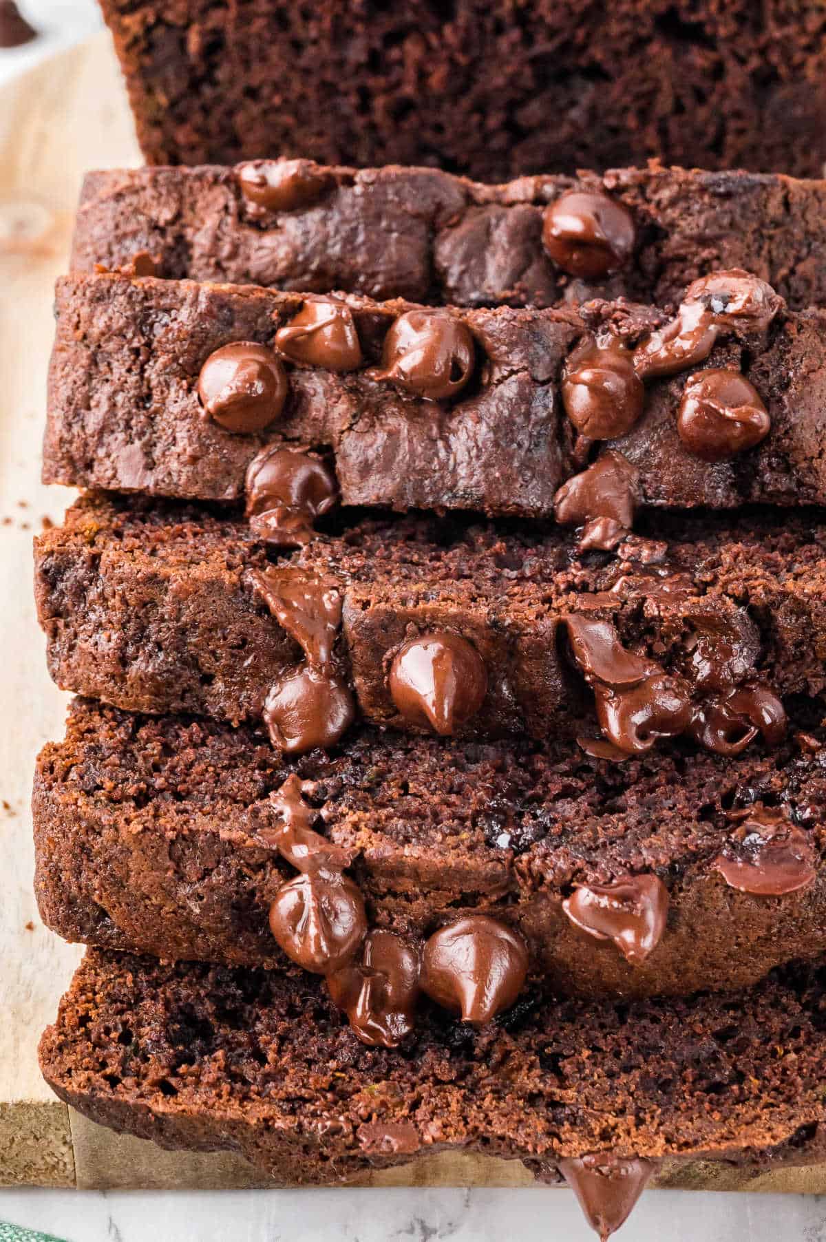 A loaf of chocolate zucchini bread sliced.