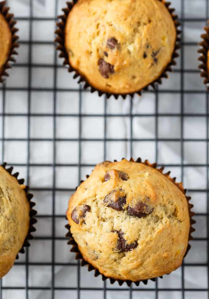 Banana Chocolate Chip Muffins - The perfect way to use up your brown bananas! This easy muffin recipe is incredibly moist and perfectly sweet.
