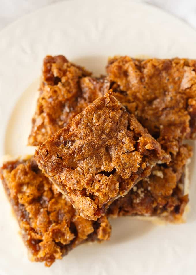Butter Tart Squares - Canada's BEST dessert! Gooey butter tart filling packed with pecans on a sweet buttery crust.