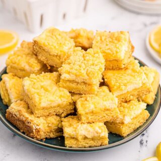 A plate of lemon cheese bars.