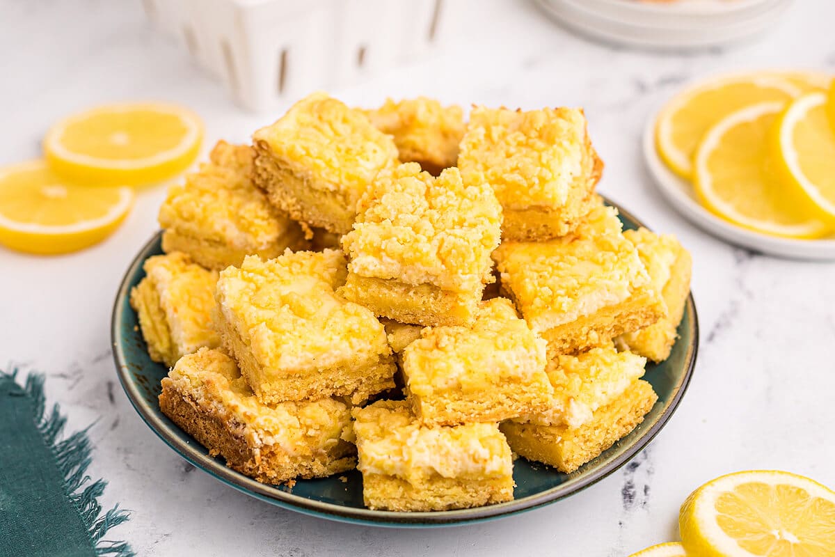 A plate of lemon cheese bars.