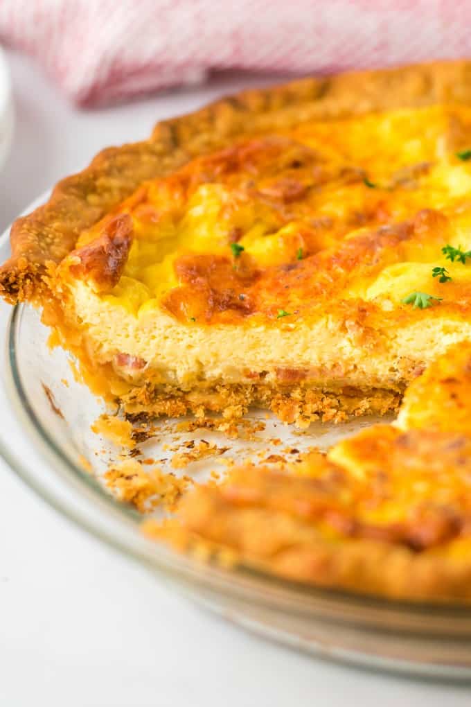 Quiche Lorraine - Easy and quick to prepare, this breakfast or brunch recipe will quickly become a weekly staple. It’s full of flavor that comes from just the right combination of bacon, cheese, half and half and eggs. Plus a little nutmeg and paprika to take it to the next level.