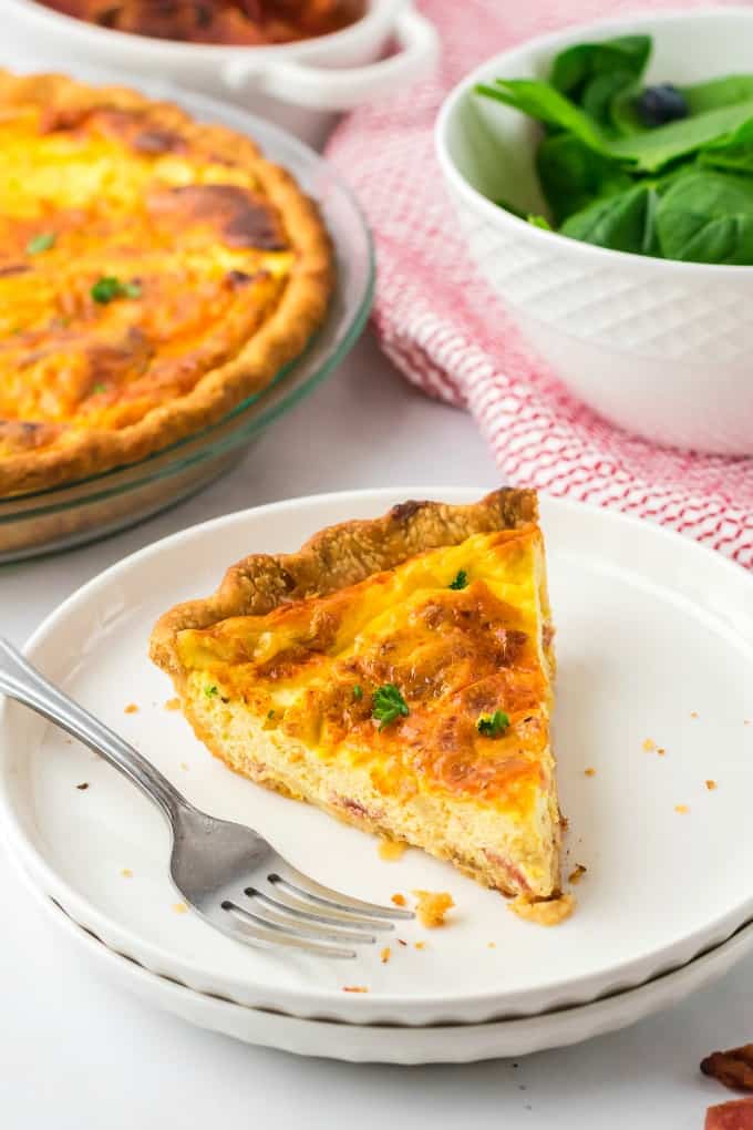 Quiche Lorraine - Easy and quick to prepare, this breakfast or brunch recipe will quickly become a weekly staple. It’s full of flavor that comes from just the right combination of bacon, cheese, half and half and eggs. Plus a little nutmeg and paprika to take it to the next level.