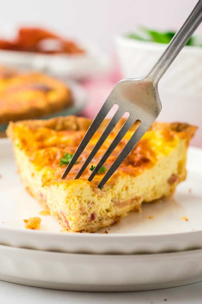 Quiche Lorraine - Easy and quick to prepare, this breakfast or brunch recipe will quickly become a weekly staple. It’s full of flavor that comes from just the right combination of bacon, cheese, half and half and eggs. Plus a little nutmeg and paprika to take it to the next level.
