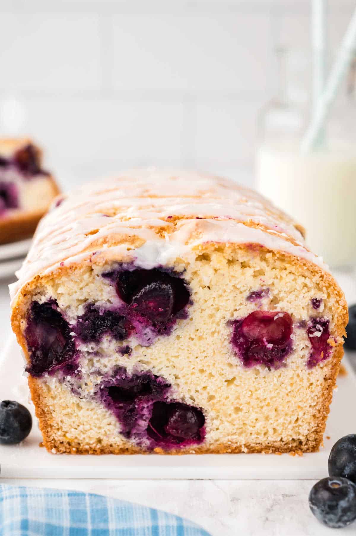Blueberry bread with a slice cut off the end.