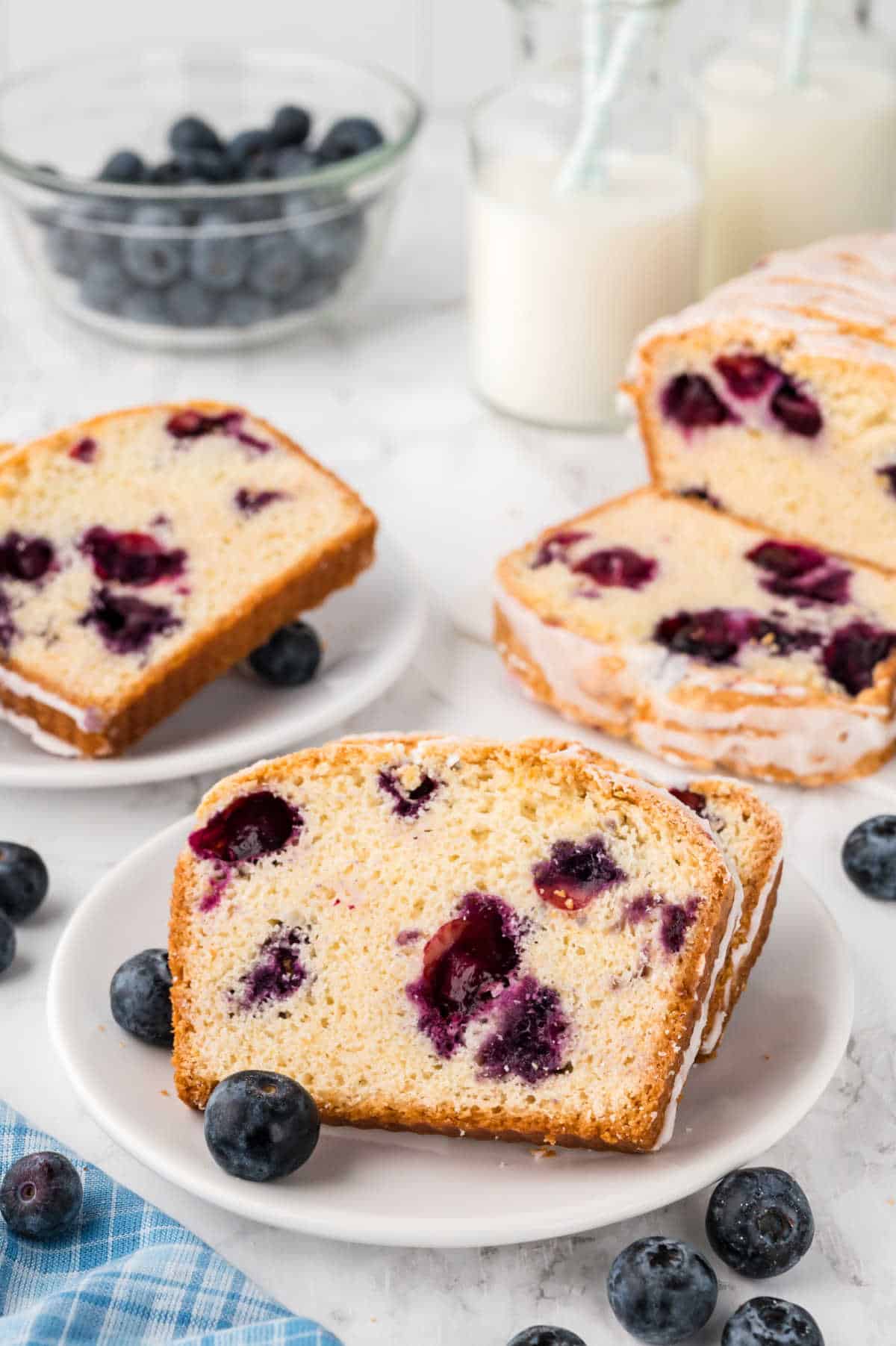 Slices of blueberry bread on a plate.