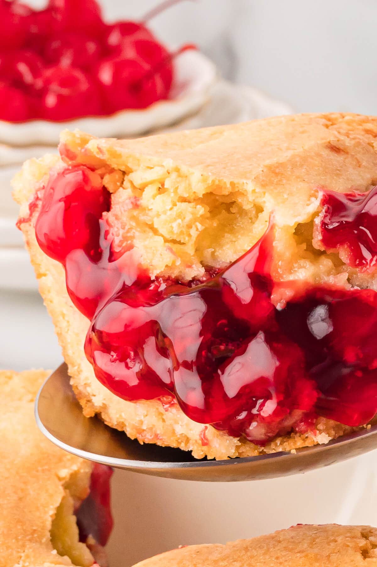 Cherry cake on a serving spoon.