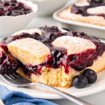 A slice of cake on a plate with fork.