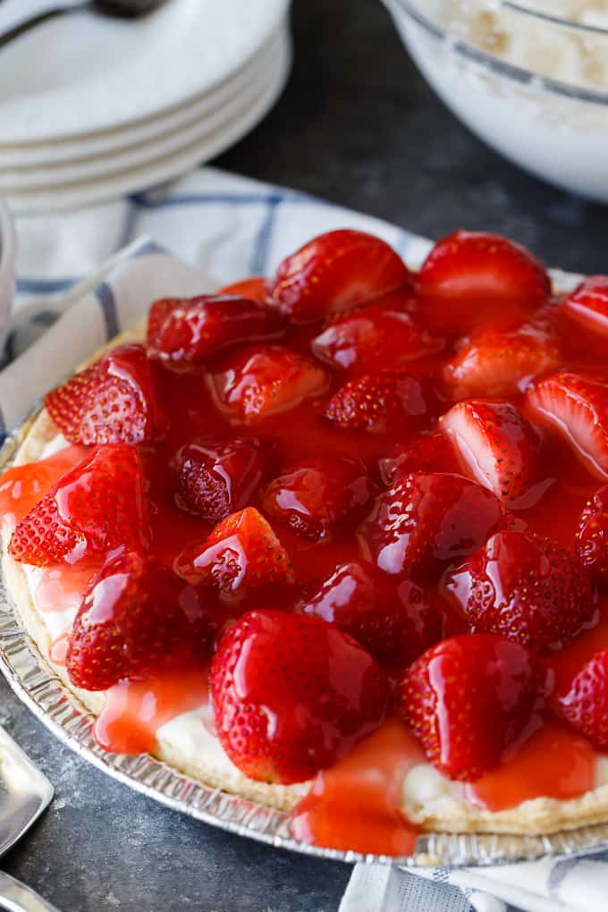 Strawberry Satin Pie - A beloved vintage summer pie that is worth the extra effort. Layers of toasted almonds, creamy and sweet vanilla filling and luscious strawberries enveloped in a shiny glaze make this dessert a huge hit.