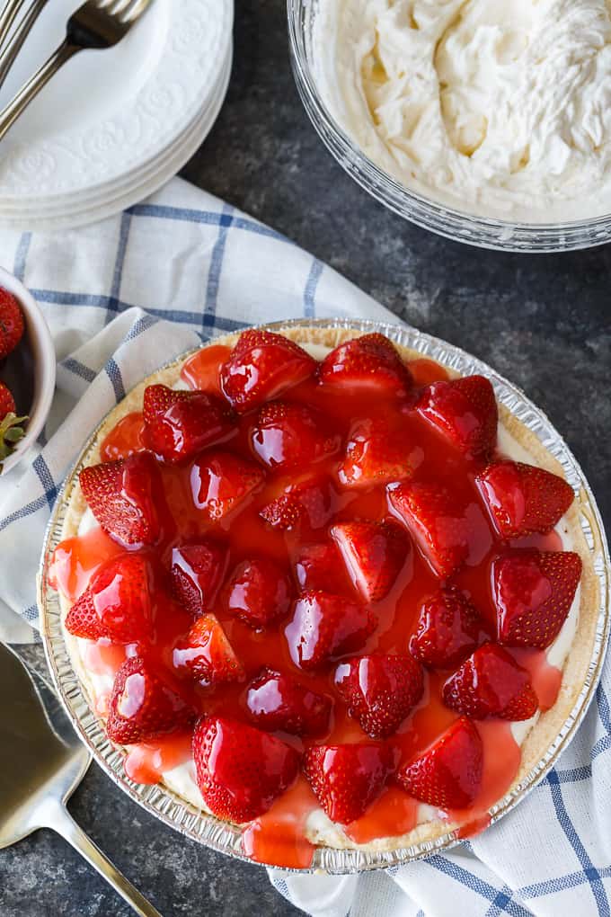 Strawberry Satin Pie - A beloved vintage summer pie that is worth the extra effort. Layers of toasted almonds, creamy and sweet vanilla filling and luscious strawberries enveloped in a shiny glaze make this dessert a huge hit.