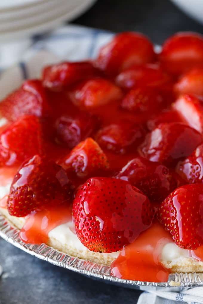 Strawberry Satin Pie - A beloved vintage summer pie that is worth the extra effort. Layers of toasted almonds, creamy and sweet vanilla filling and luscious strawberries enveloped in a shiny glaze make this dessert a huge hit.