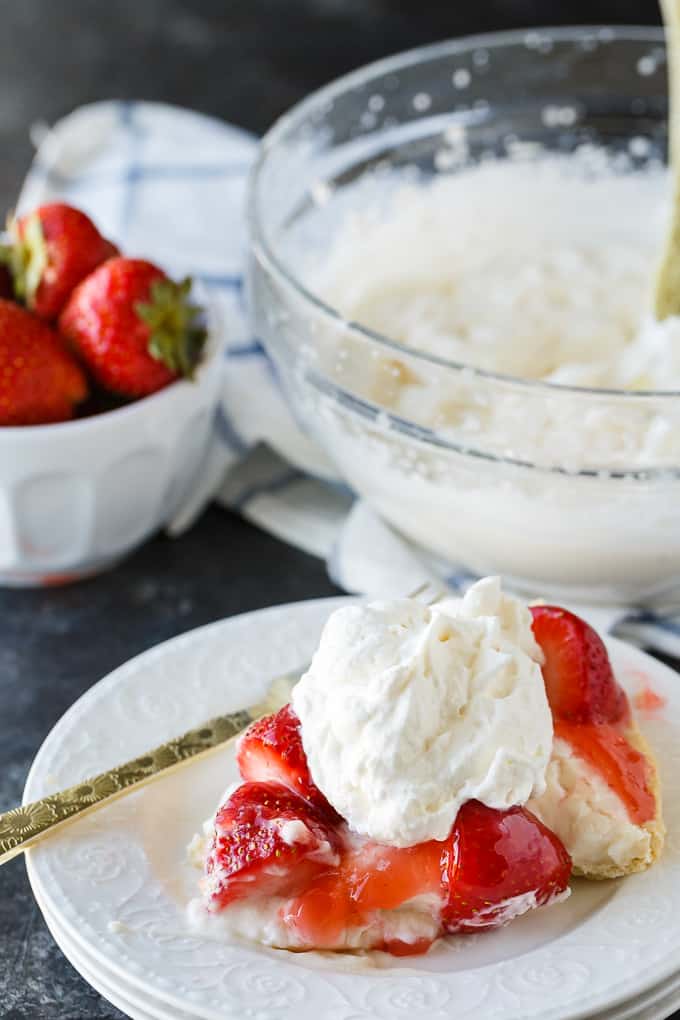 Strawberry Satin Pie - A beloved vintage summer pie that is worth the extra effort. Layers of toasted almonds, creamy and sweet vanilla filling and luscious strawberries enveloped in a shiny glaze make this dessert a huge hit.