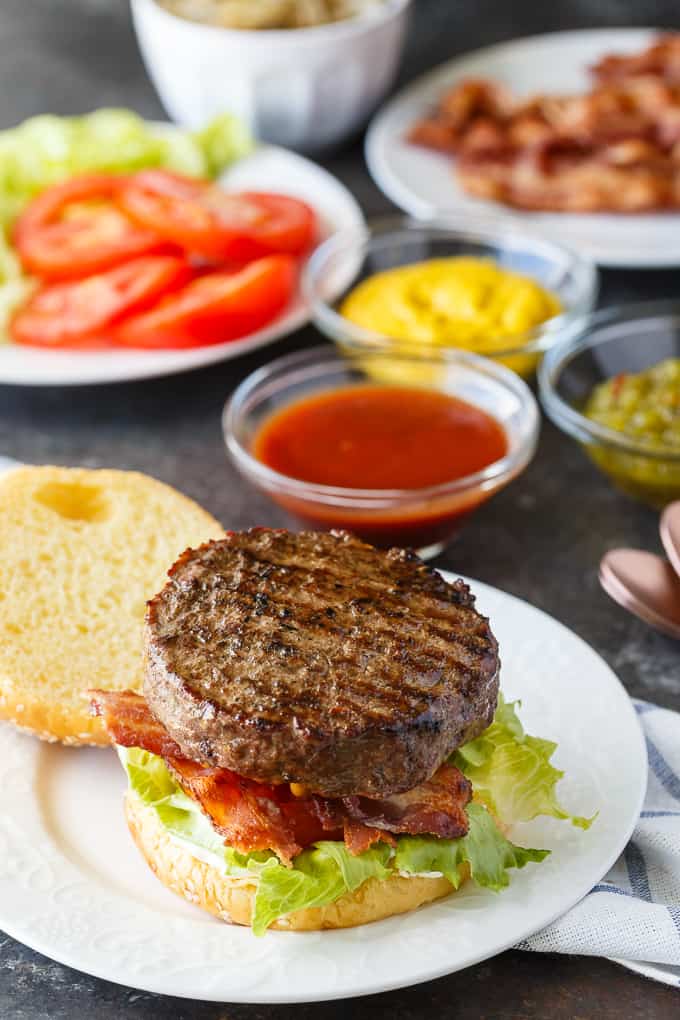 Easy Stuffed Burgers - The easiest stuffed burgers you'll ever make! Tender, juicy and flavorful beef patties are stuffed with cheddar cheese, mushrooms and onions. 