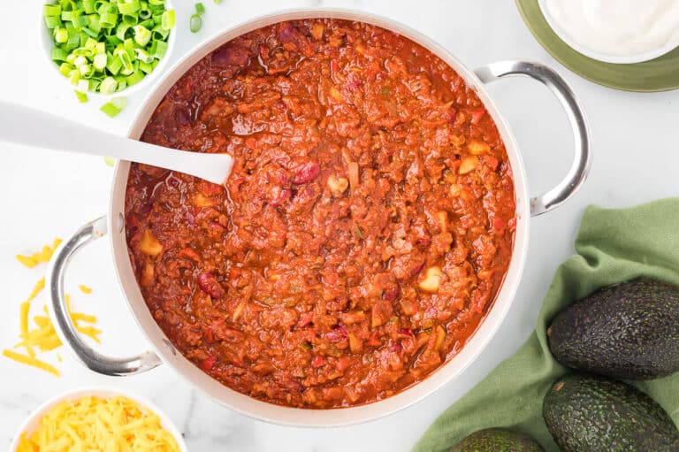 The recipe in a pot with a ladle.