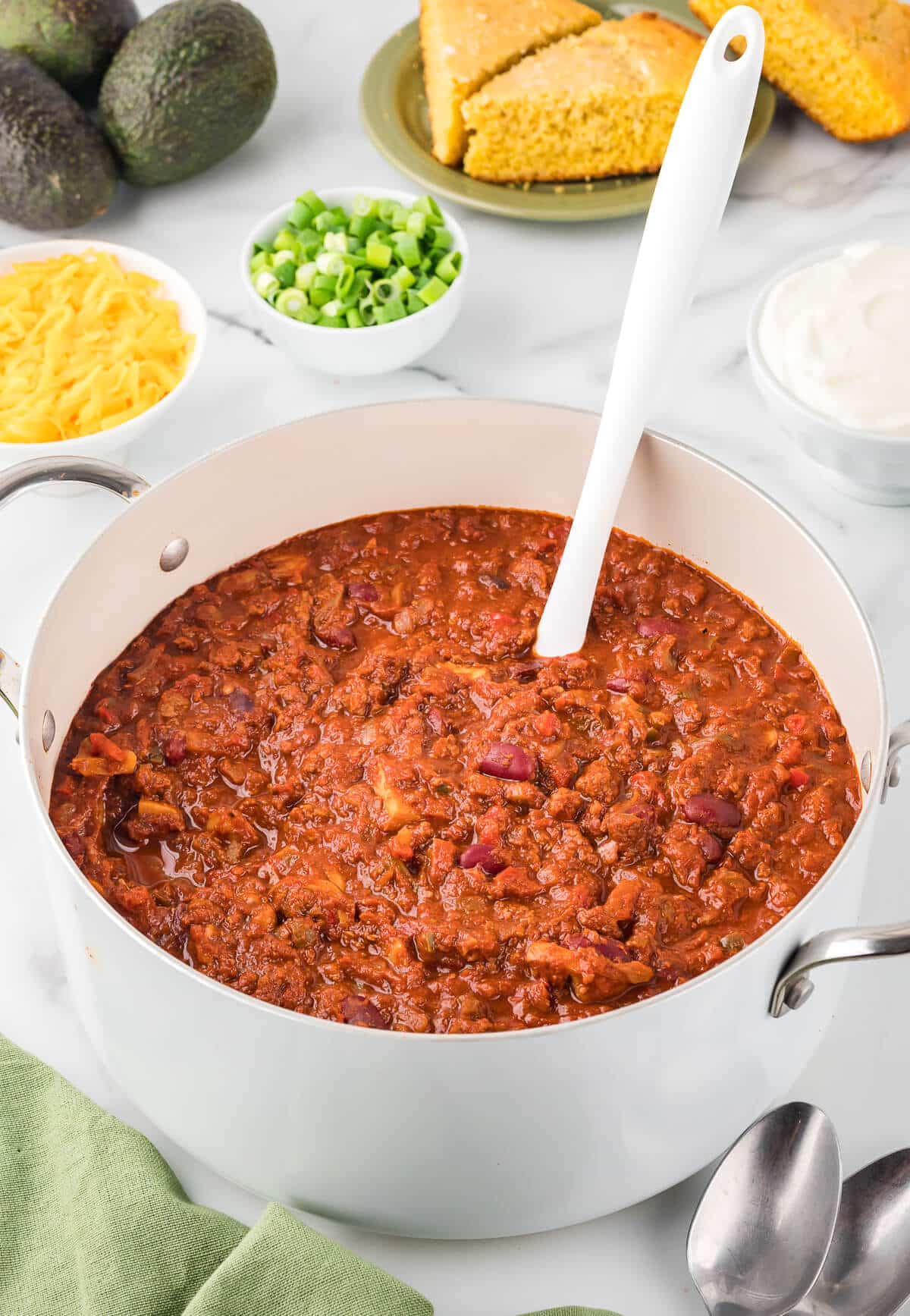 Chili in a pot with a ladle.
