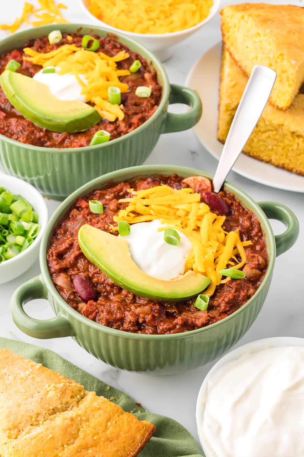 Chili in a bowl with toppings.