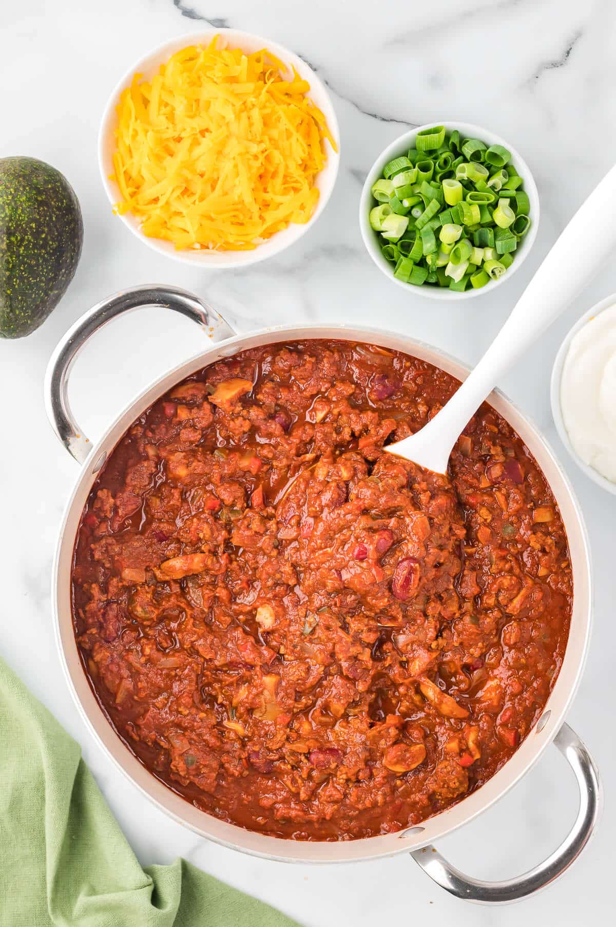 Chili in a pot with a ladle.