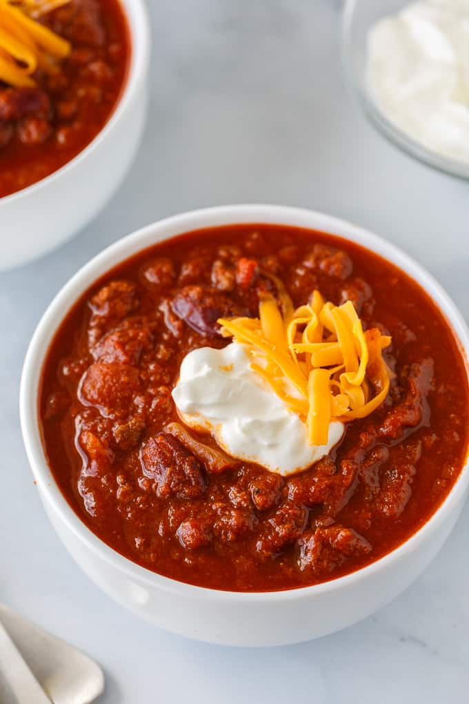 The Best Chili Recipe - My family says this is the BEST chili recipe ever! It's hearty, comforting and flavorful. Made with ground beef, veggies, kidney beans and spices.